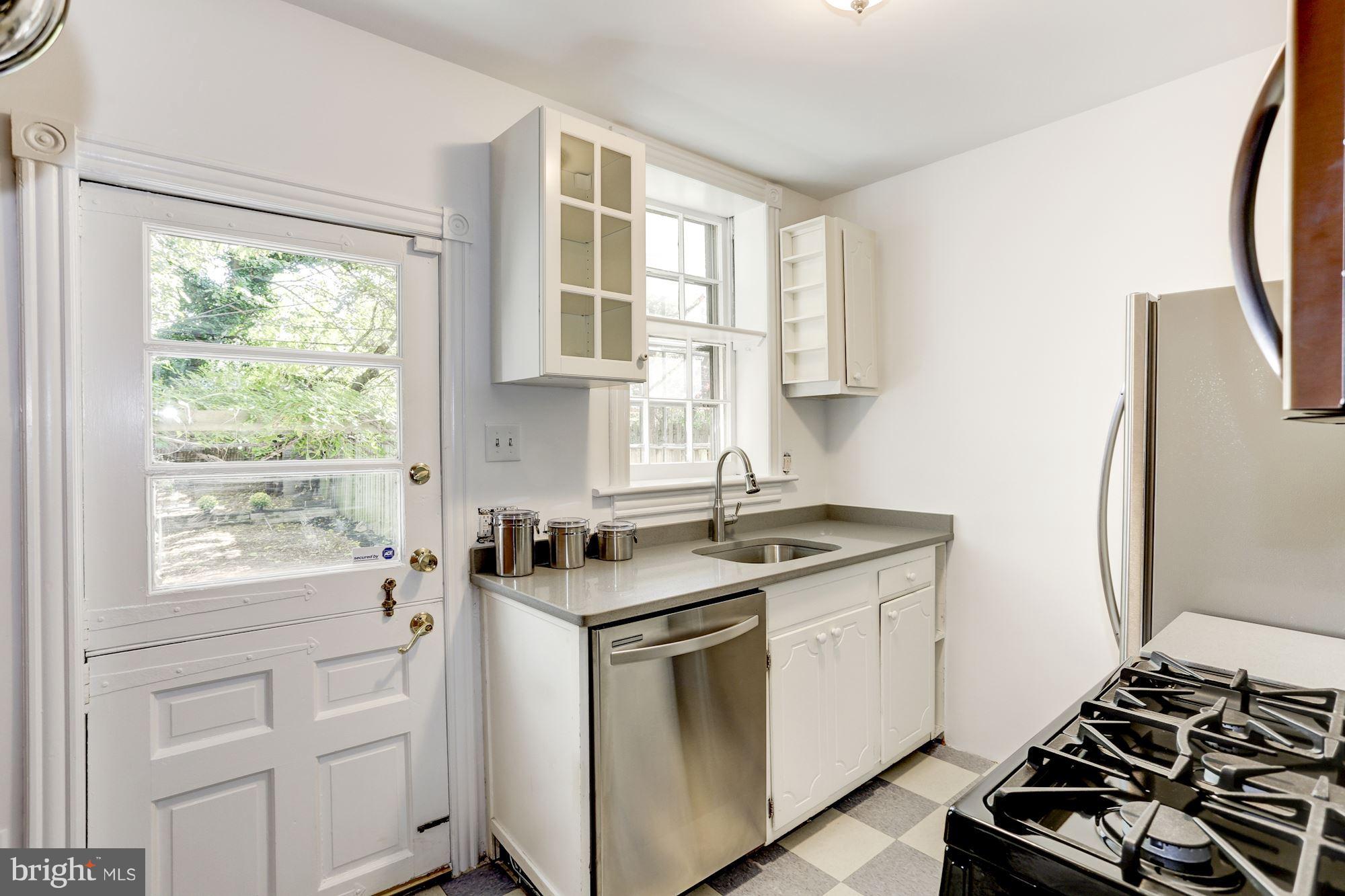 425 5th Street Northeast Washington, DC 20002 - Photo 10 of 21 a kitchen with a stove a sink and a window
