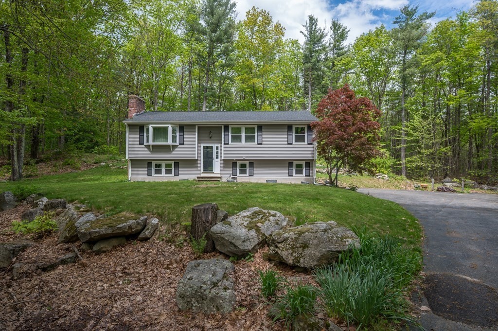 179 Beaman Road Princeton, MA 01541 - Photo 1 of 34 a view of a big house with a big yard and large trees