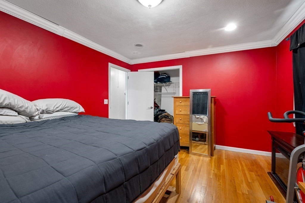 179 Beaman Road Princeton, MA 01541 - Photo 17 of 34 a bedroom with a bed and a flat screen tv