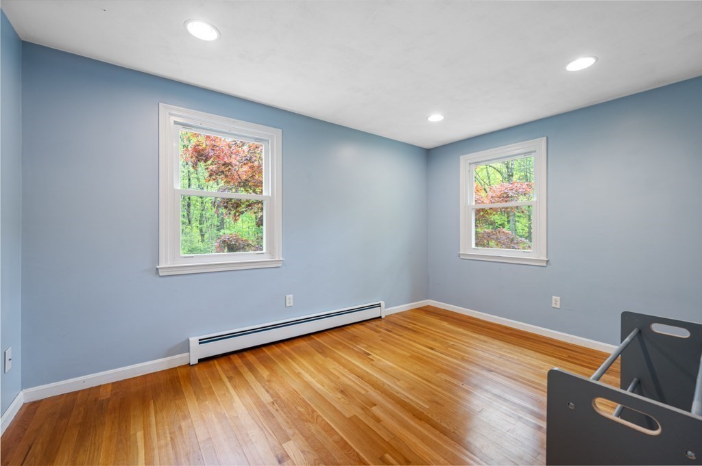 179 Beaman Road Princeton, MA 01541 - Photo 20 of 34 a view of room with window and wooden floor