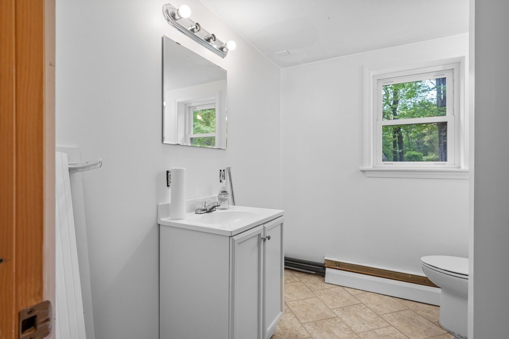 179 Beaman Road Princeton, MA 01541 - Photo 23 of 34 a bathroom with a sink a toilet and a window