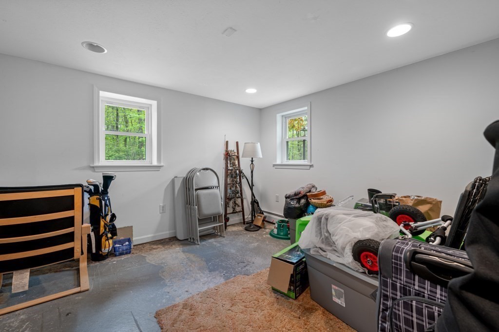179 Beaman Road Princeton, MA 01541 - Photo 25 of 34 a bedroom with furniture a window and gym equipment