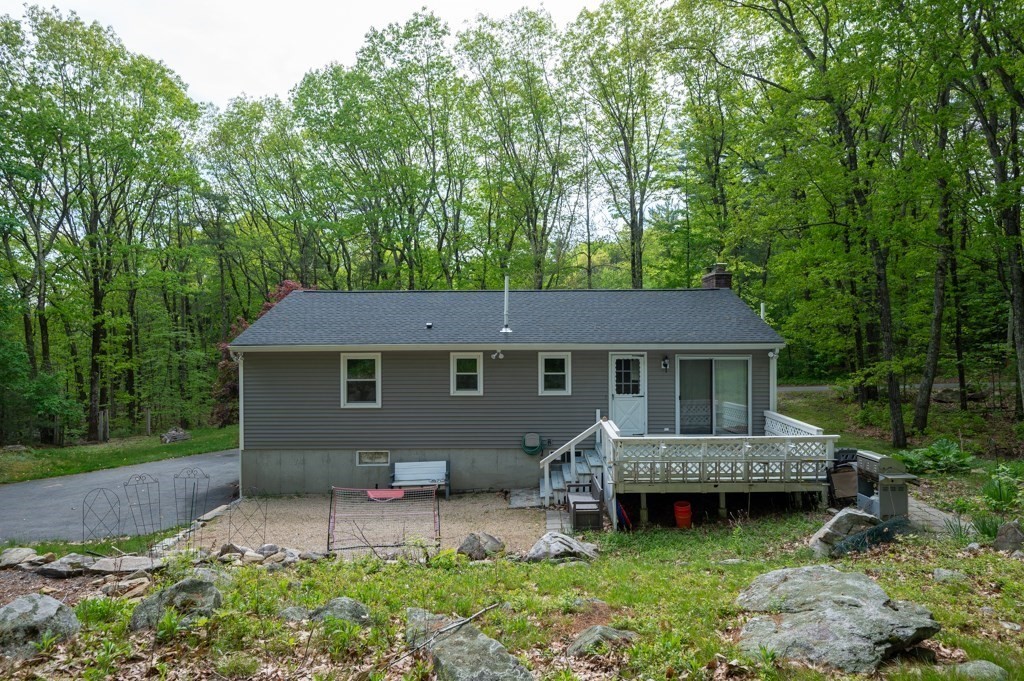 179 Beaman Road Princeton, MA 01541 - Photo 33 of 34 a view of a house with a backyard and a patio
