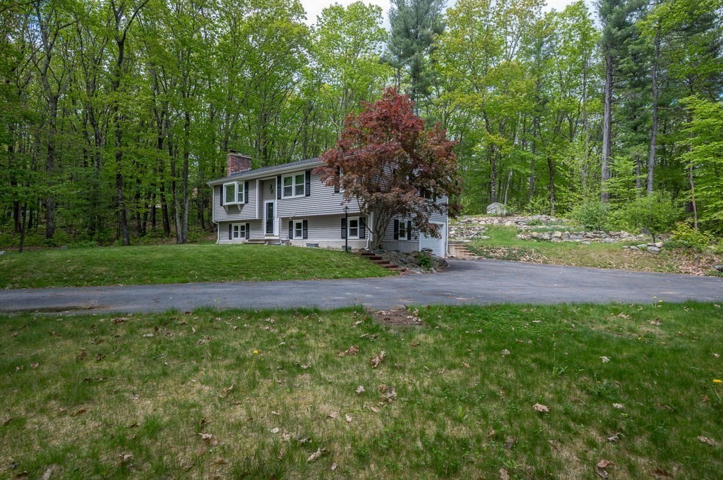 179 Beaman Road Princeton, MA 01541 - Photo 5 of 34 a view of a house with a yard