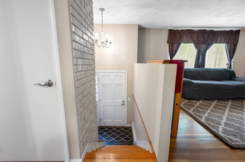 179 Beaman Road Princeton, MA 01541 - Photo 6 of 34 a view of a hallway with windows and stairs