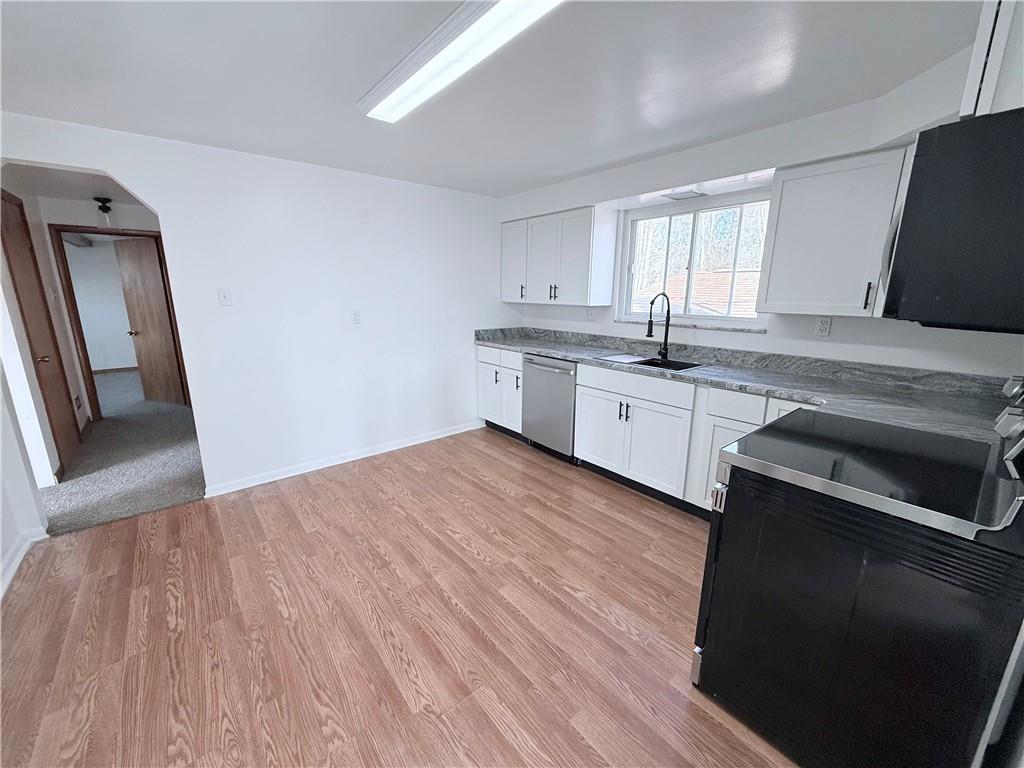 2724 Lookout Drive Elizabeth, PA 15037 - Photo 11 of 31 a kitchen with granite countertop a sink wooden floor and stainless steel appliances