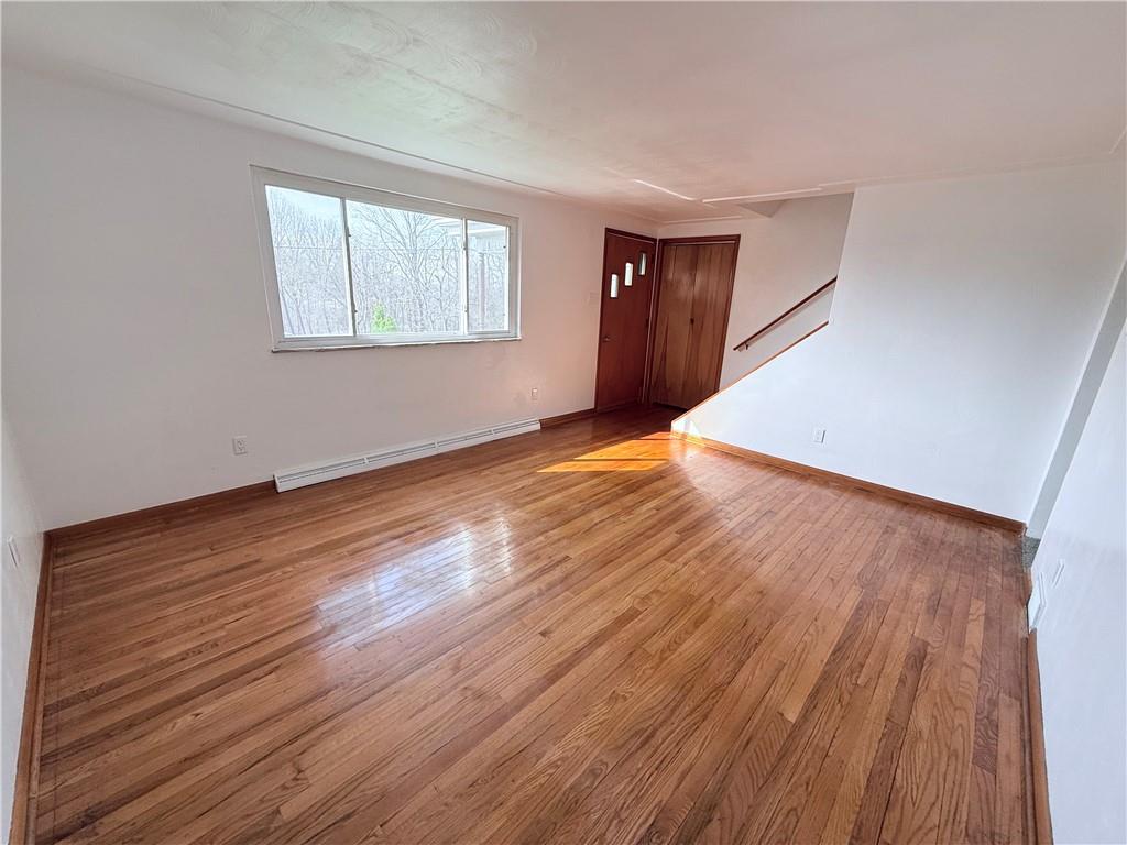 2724 Lookout Drive Elizabeth, PA 15037 - Photo 19 of 31 a view of an empty room with wooden floor and a window