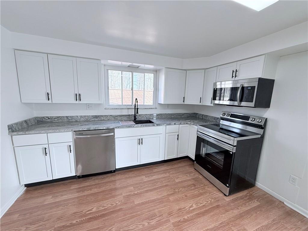 2724 Lookout Drive Elizabeth, PA 15037 - Photo 9 of 31 a kitchen with granite countertop a sink and steel appliances