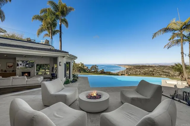 a view of a patio with couches and a table and chairs