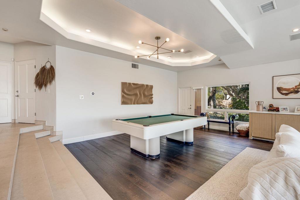 1904 Via Casa Alta La Jolla, CA 92037 - Photo 19 of 60 a living room with furniture and a chandelier