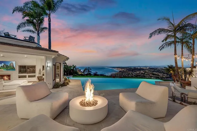 a view of a patio with couches chairs and a potted plant