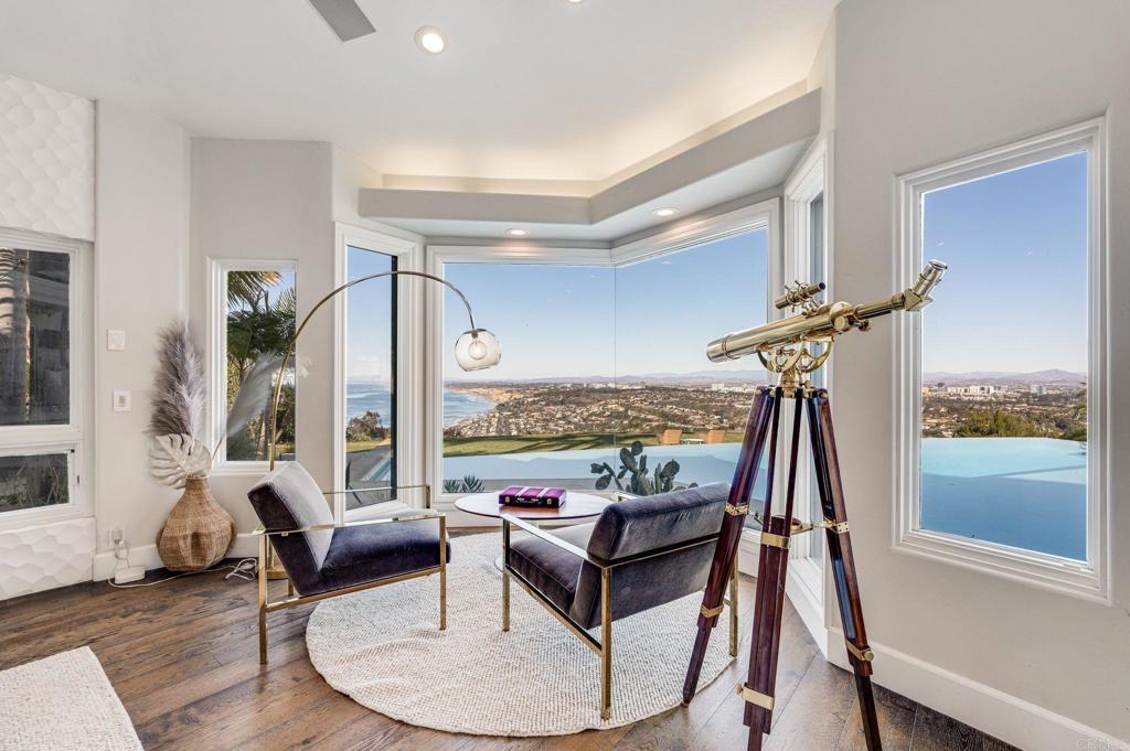 1904 Via Casa Alta La Jolla, CA 92037 - Photo 21 of 60 a living room with furniture and a floor to ceiling window