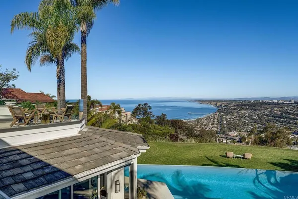 a house with swimming pool in front of it