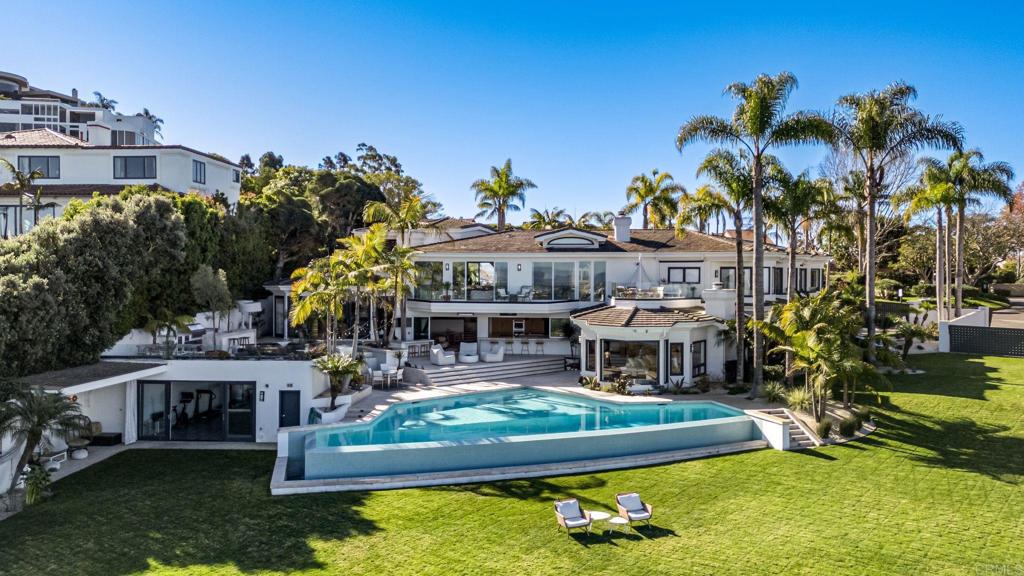 1904 Via Casa Alta La Jolla, CA 92037 - Photo 26 of 60 a view of a house with swimming pool and a yard