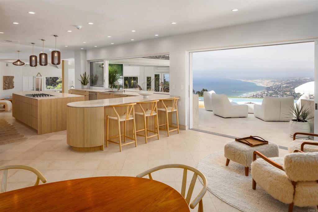 1904 Via Casa Alta La Jolla, CA 92037 - Photo 3 of 60 a large kitchen with a table and chairs
