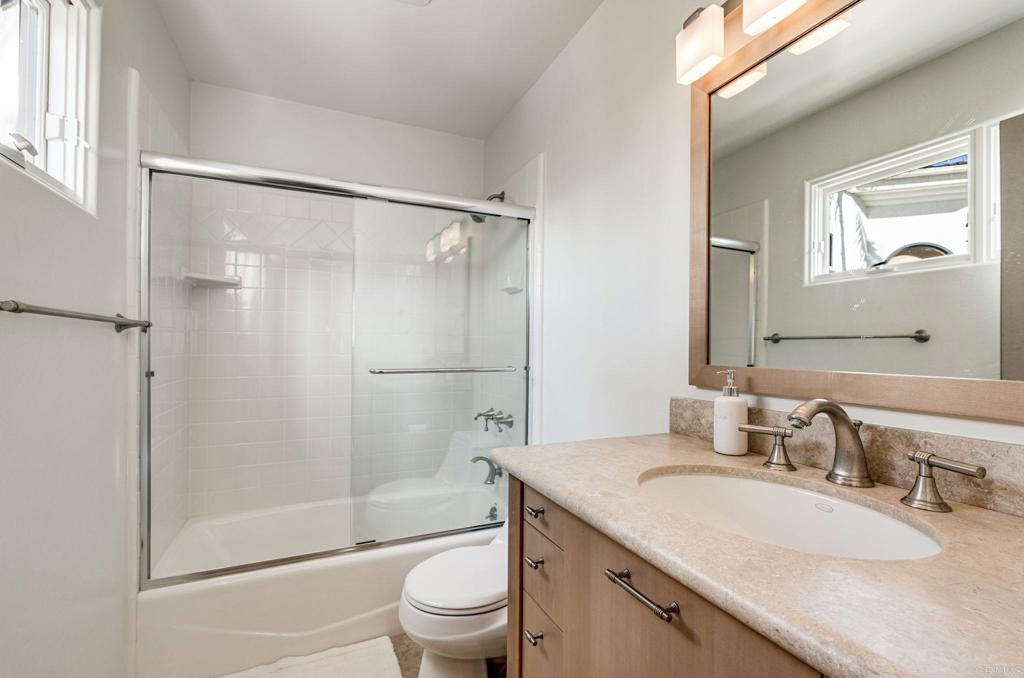 1904 Via Casa Alta La Jolla, CA 92037 - Photo 36 of 60 a bathroom with a granite countertop sink toilet and shower