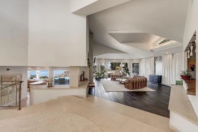 a view of a livingroom with furniture and windows