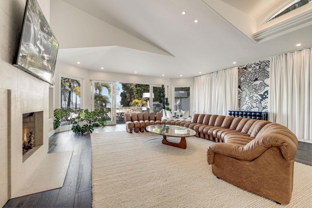 1904 Via Casa Alta La Jolla, CA 92037 - Photo 42 of 60 a living room with furniture potted plant and a fireplace