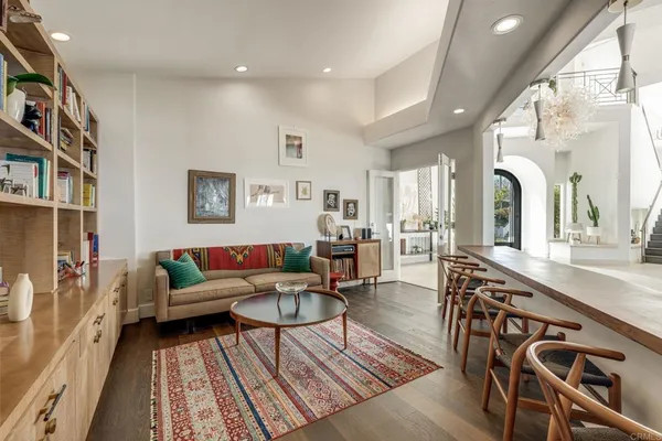 a spacious bedroom with a large bed and a large window