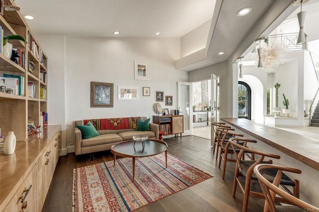 a spacious bedroom with a large bed and a large window