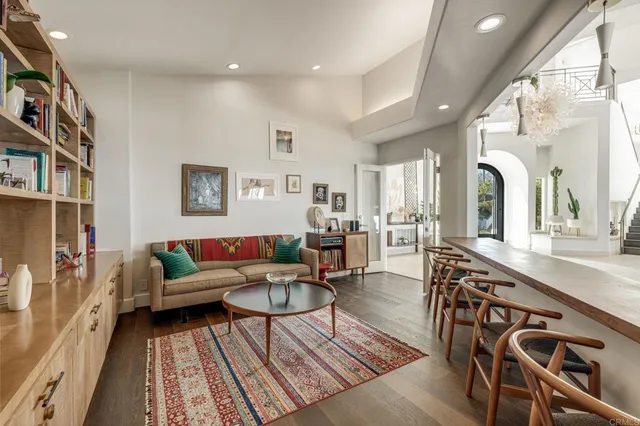 a spacious bedroom with a large bed and a large window