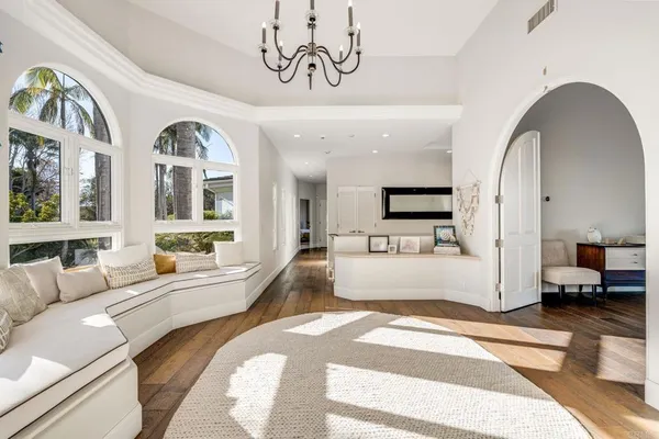 a bathroom with a granite countertop sink toilet mirror and shower