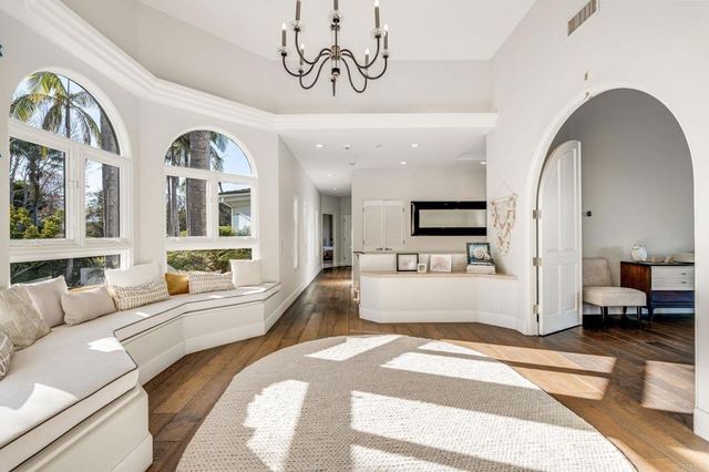 a bathroom with a granite countertop sink toilet mirror and shower