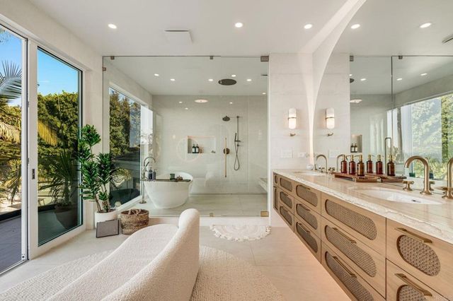 a spacious bedroom with a bed and a refrigerator