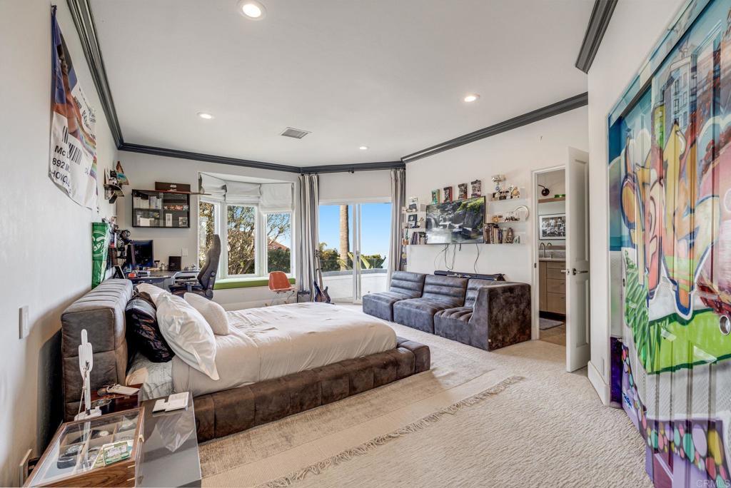 1904 Via Casa Alta La Jolla, CA 92037 - Photo 56 of 60 a bedroom with furniture and a large mirror