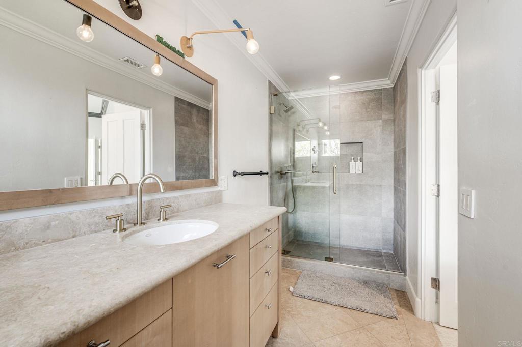 1904 Via Casa Alta La Jolla, CA 92037 - Photo 57 of 60 a bathroom with a shower sink double and mirror