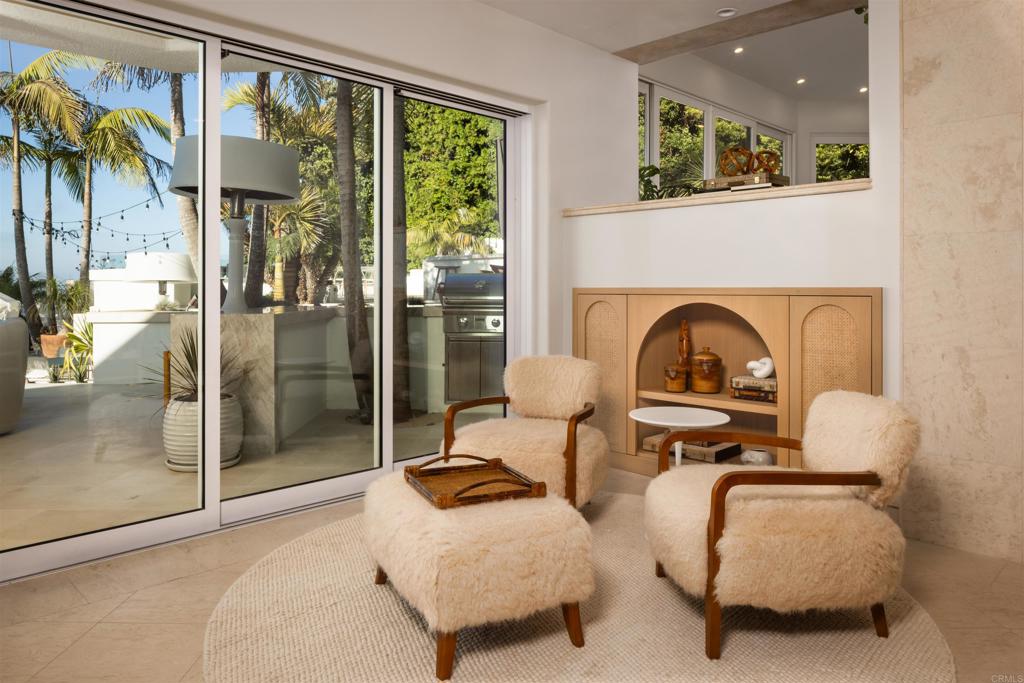 1904 Via Casa Alta La Jolla, CA 92037 - Photo 8 of 60 a living room with furniture and a floor to ceiling window