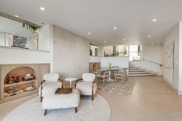 a large kitchen with stainless steel appliances a sink and cabinets