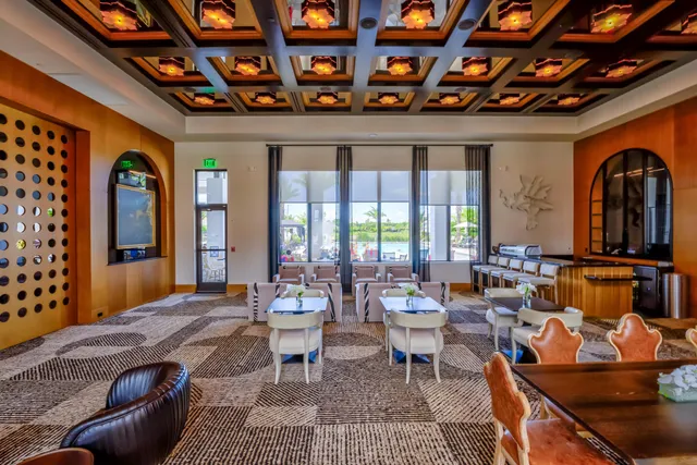 a living room with furniture a fireplace and city view