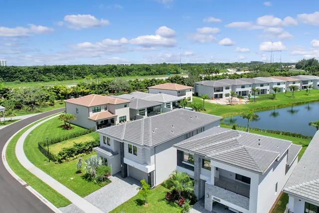 an aerial view of a house with garden space and outdoor seating