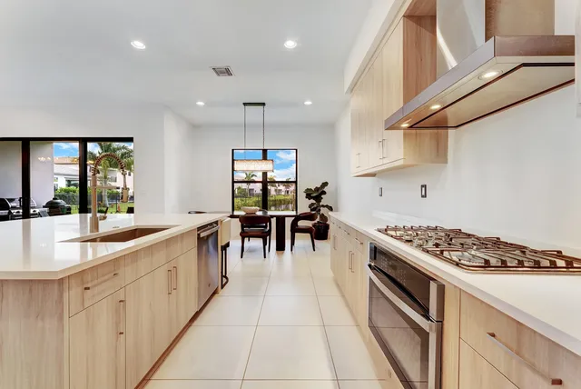 a kitchen with counter top space appliances and cabinets