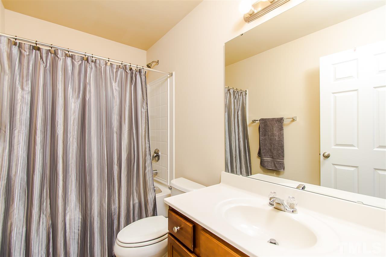 744 Stackhurst Way Wake Forest, NC 27587 - Photo 14 of 21 Bathroom with large vanity, shower/tub combo and large mirror. Plenty of counter space for everyone.