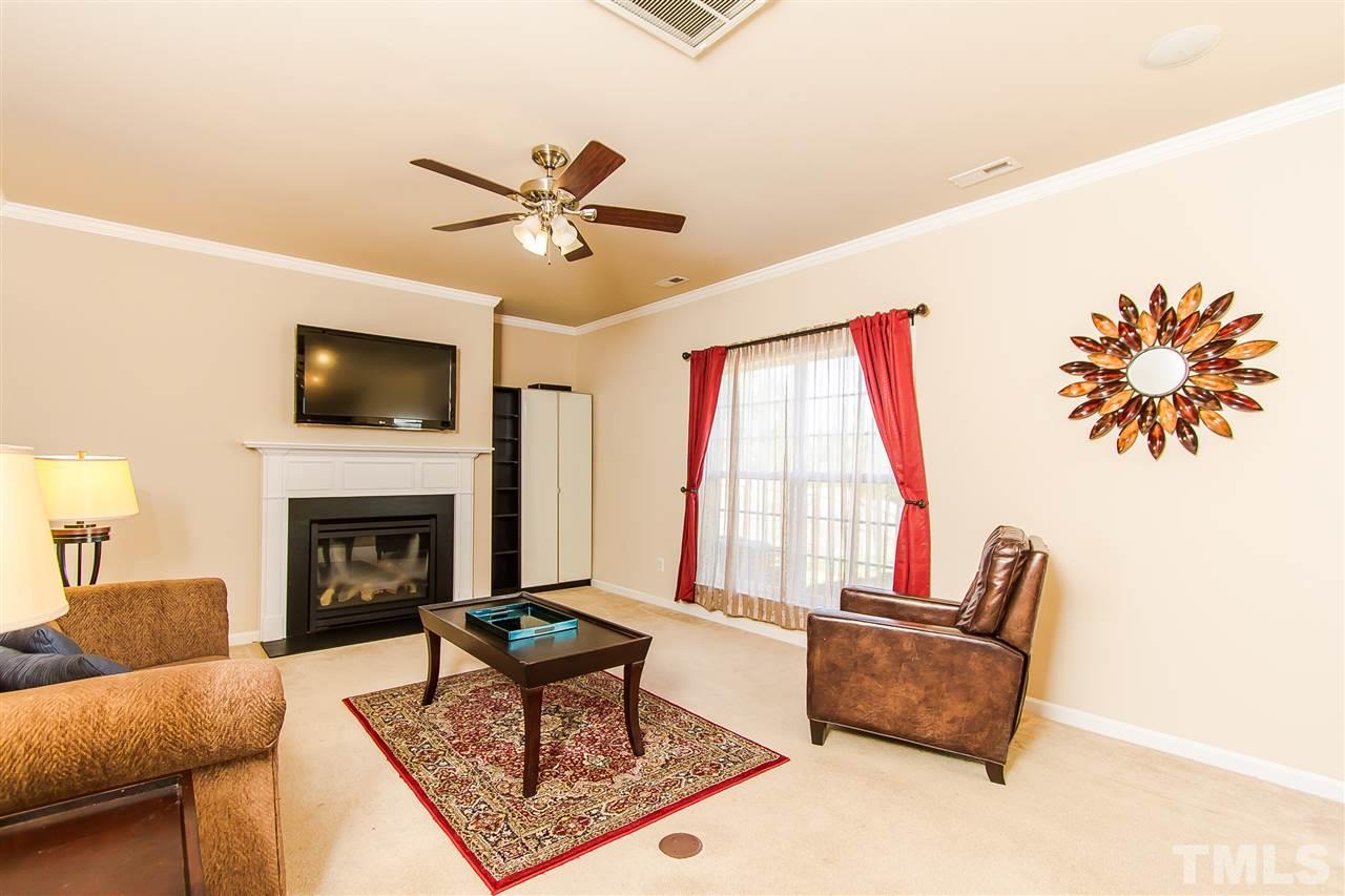 744 Stackhurst Way Wake Forest, NC 27587 - Photo 4 of 21 The family room adjoins the kitchen and sun room making a wonderful entertaining area. Large windows allow plenty of natural light into the room. Cozy up the fireplace on those cold winter nights. Have fun decorating the mantel with your treasures.
