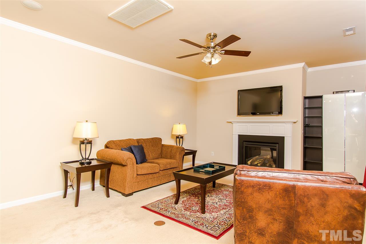 744 Stackhurst Way Wake Forest, NC 27587 - Photo 5 of 21 This large family room has neutral walls and carpet which will make decorating a breeze. Crown moulding, ceiling fan, wooden mantel, surround sound and an area for built in book cases will appeal to everyone in the family.