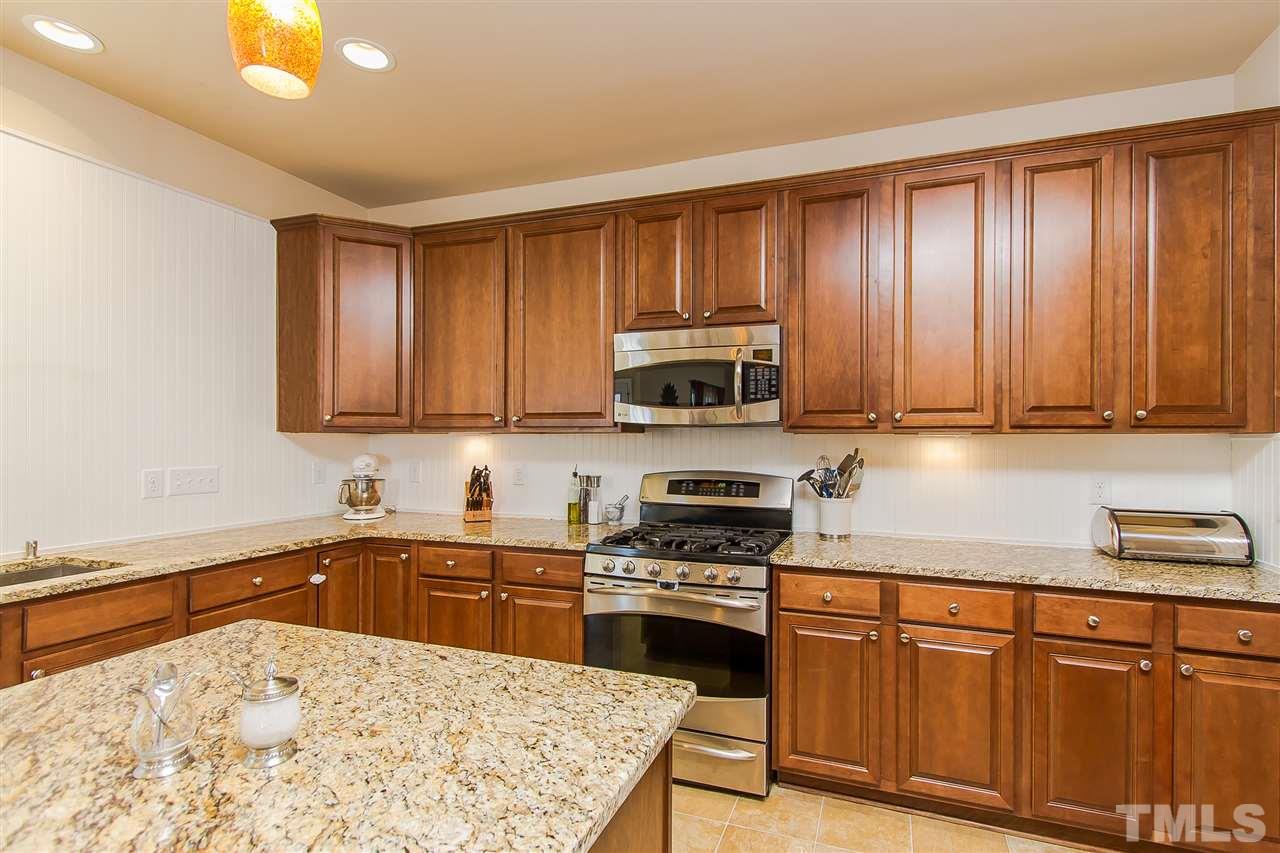 744 Stackhurst Way Wake Forest, NC 27587 - Photo 8 of 21 No problem finding counter space for the master chef in the family. Enough space for all the slicing and dicing! Granite counters, a five burner gas stove, bead board back splash, and stainless appliances are just the elegant touch every kitchen needs.