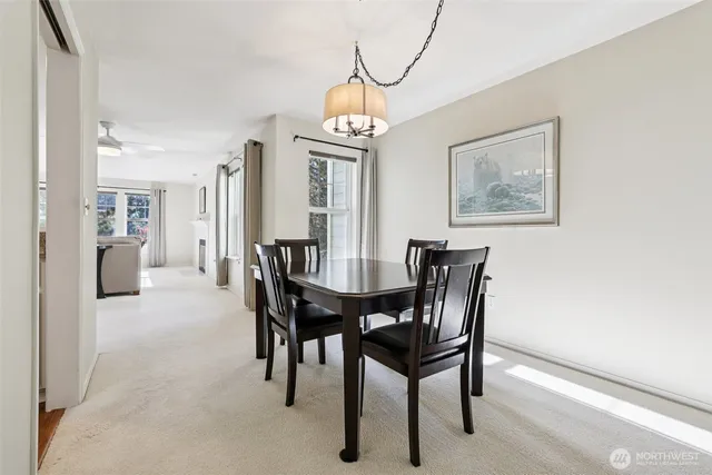 a dining room with furniture and window