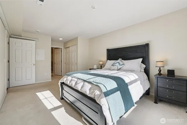 a bedroom with a bed and dresser