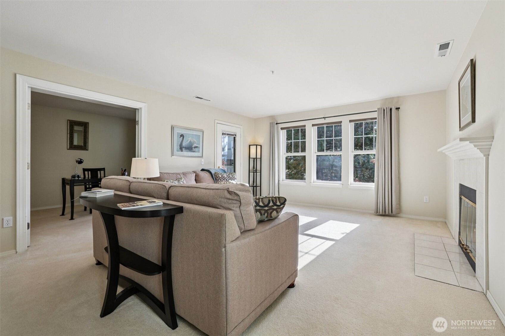 4109 224th Lane Southeast, Unit 207 Issaquah, WA 98029 - Photo 18 of 32 a living room with furniture and a fireplace