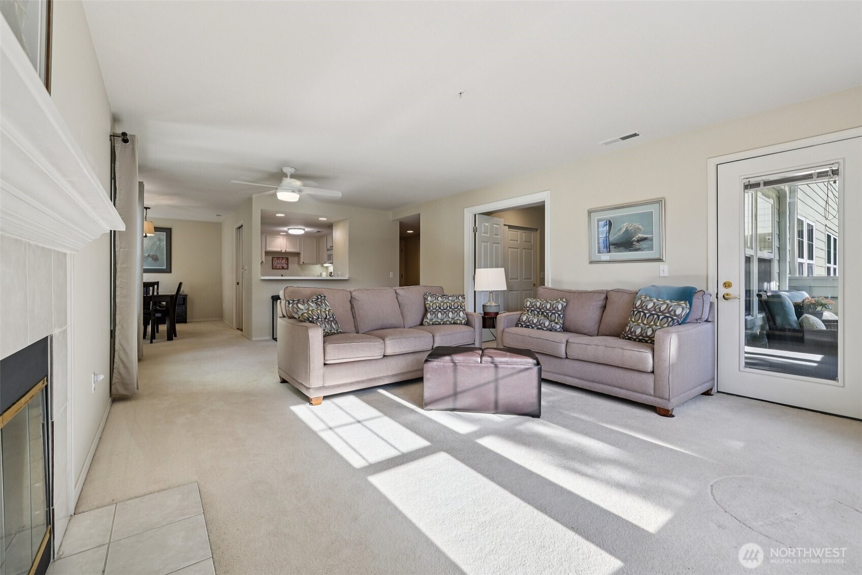 4109 224th Lane Southeast, Unit 207 Issaquah, WA 98029 - Photo 19 of 32 a living room with furniture and a view of kitchen