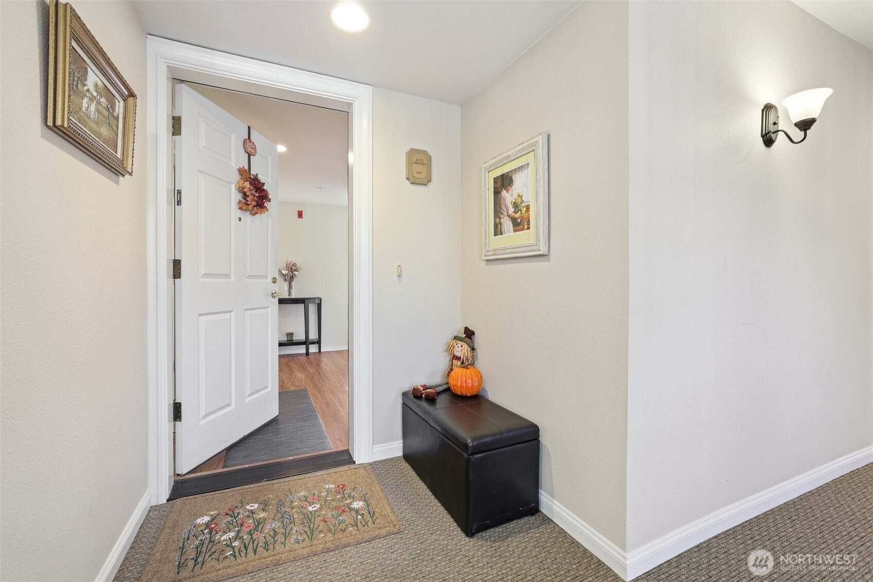 4109 224th Lane Southeast, Unit 207 Issaquah, WA 98029 - Photo 2 of 32 a view of a hallway with workspace