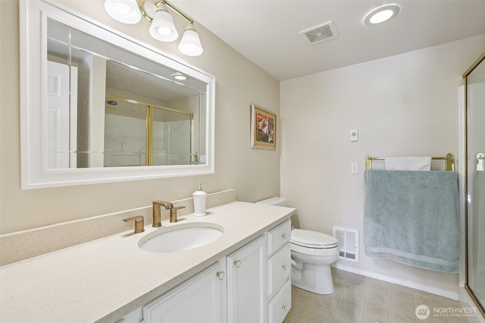 4109 224th Lane Southeast, Unit 207 Issaquah, WA 98029 - Photo 22 of 32 a bathroom with a sink a toilet and shower