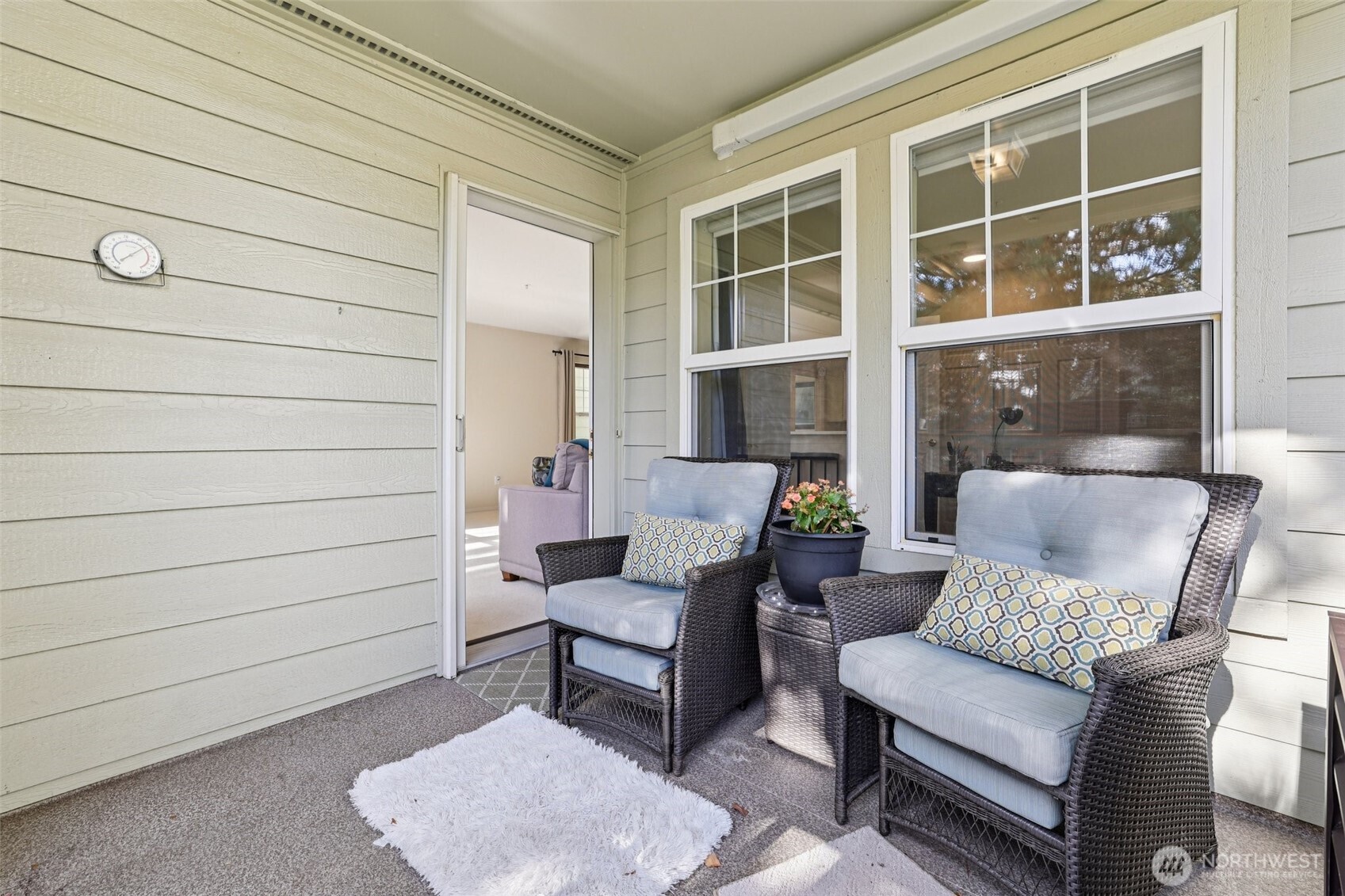 4109 224th Lane Southeast, Unit 207 Issaquah, WA 98029 - Photo 26 of 32 a outdoor living space with furniture and a potted plant