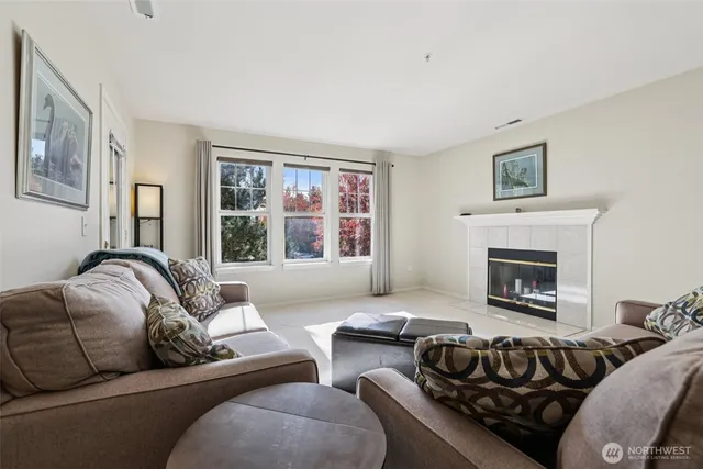 a bedroom with furniture and a fireplace