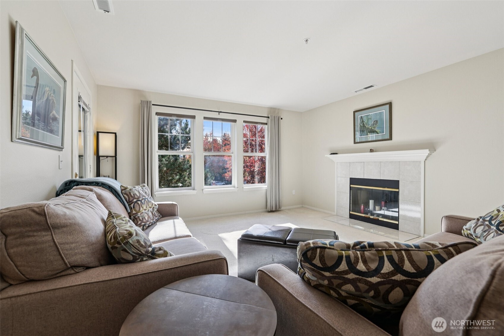 4109 224th Lane Southeast, Unit 207 Issaquah, WA 98029 - Photo 3 of 32 a bedroom with furniture and a fireplace