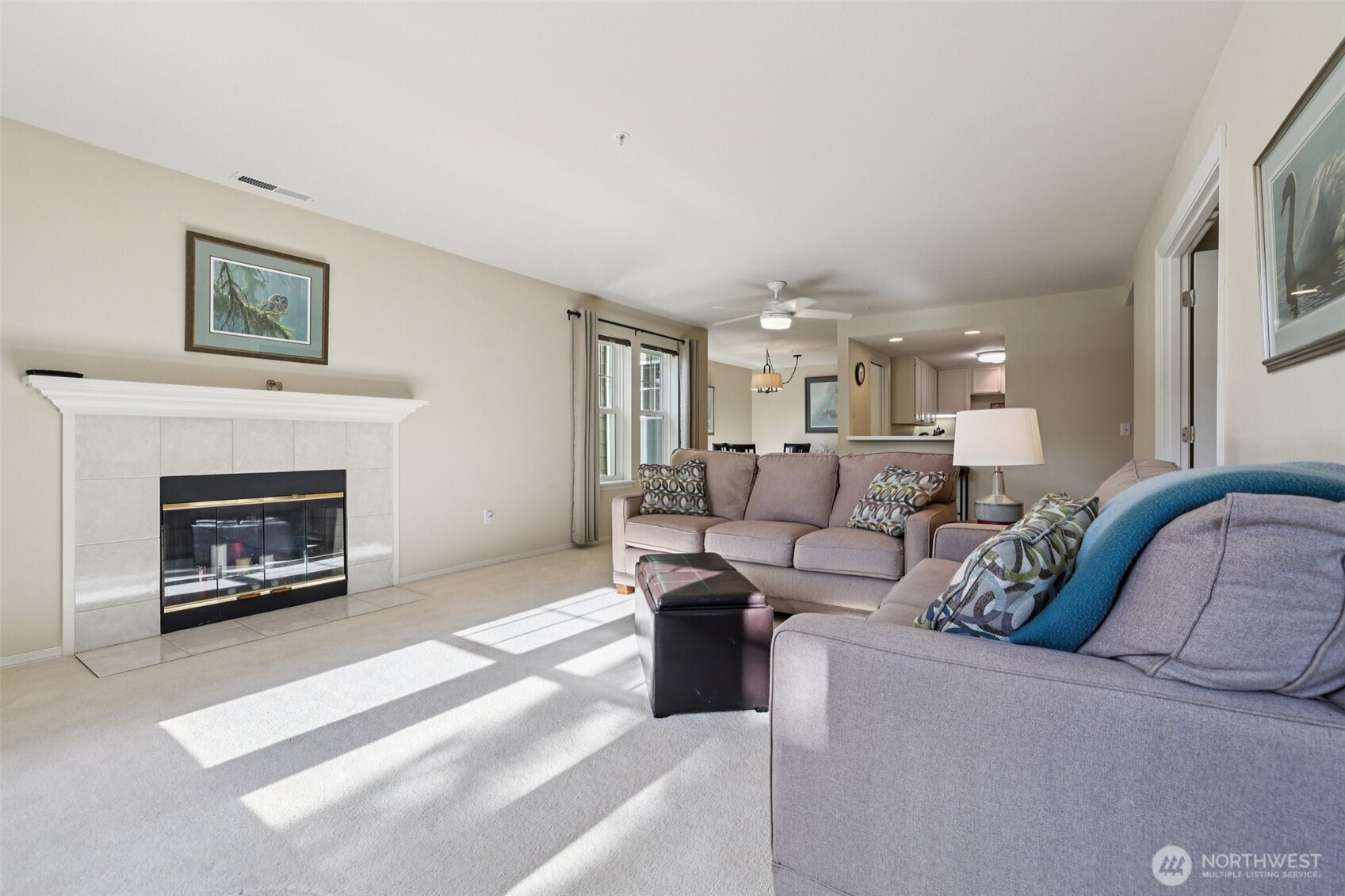 4109 224th Lane Southeast, Unit 207 Issaquah, WA 98029 - Photo 4 of 32 a living room with furniture and a fireplace