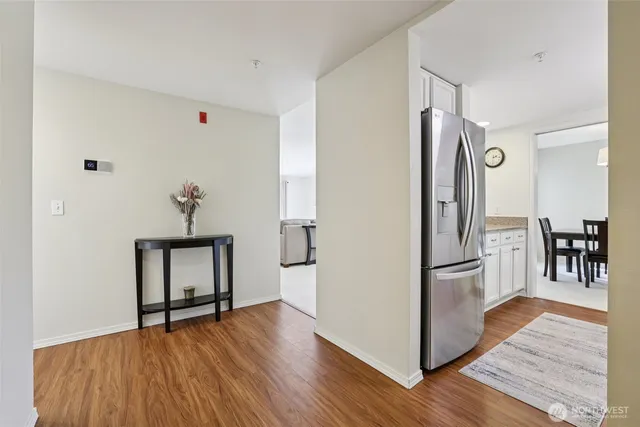 a view of kitchen with furniture and wooden floor